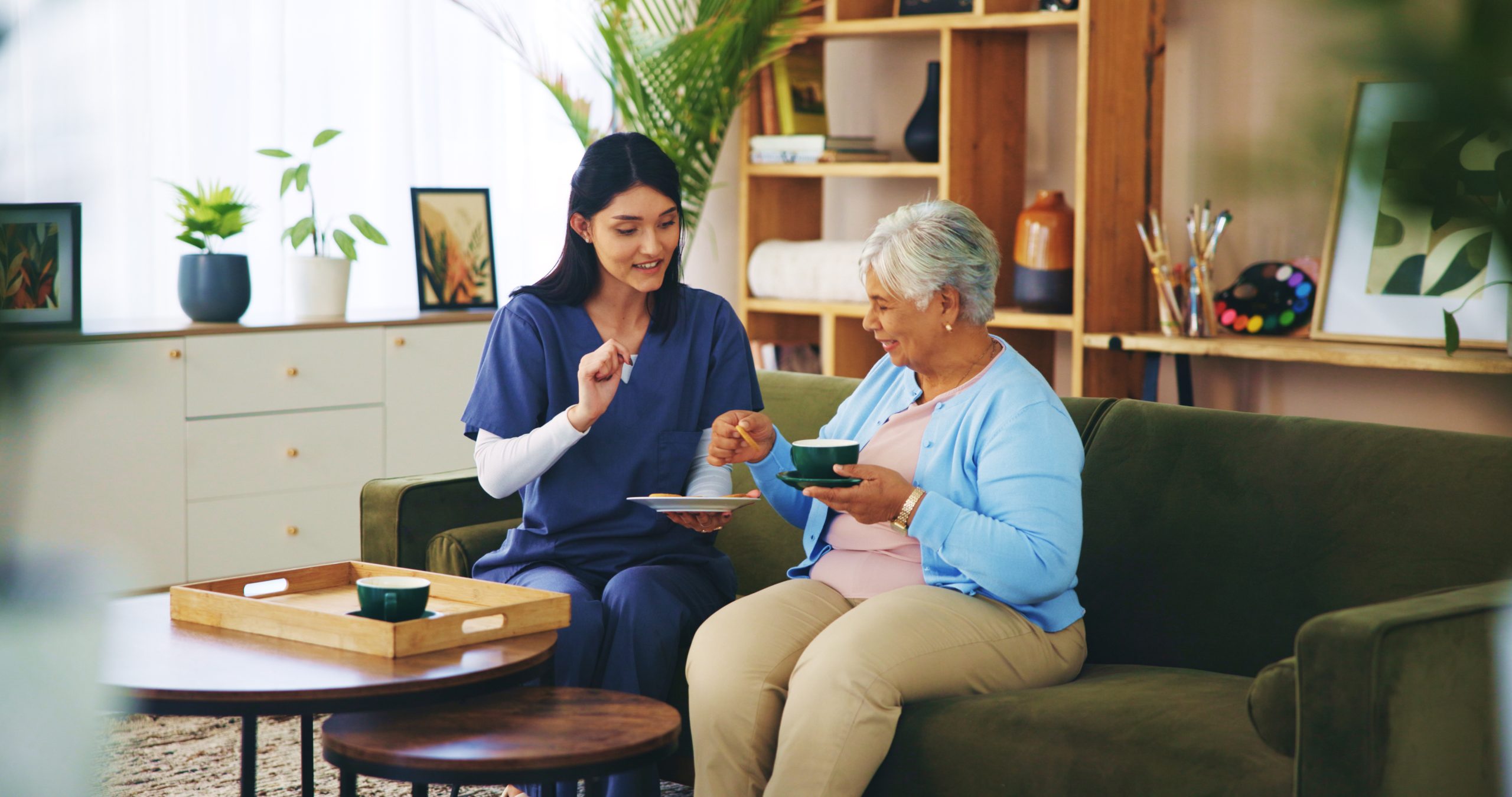 Homecare client having tea with care provider